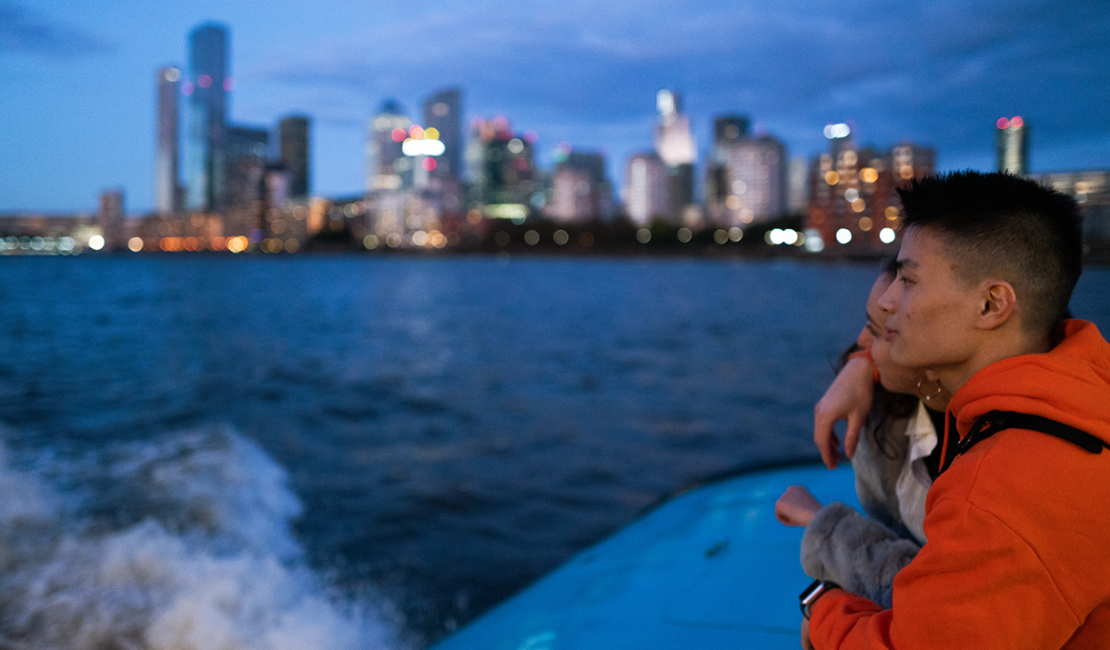 Couple on Uber Boat by Thames Clippers in the evening